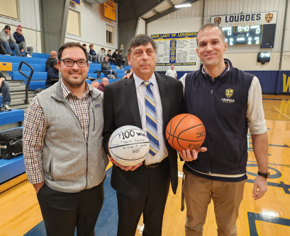 Prior to the start of tonight's game, Lourdes Athletic Director, Matt Petruzzelli and Associate AD, Rich Curran presented Coach Santo...